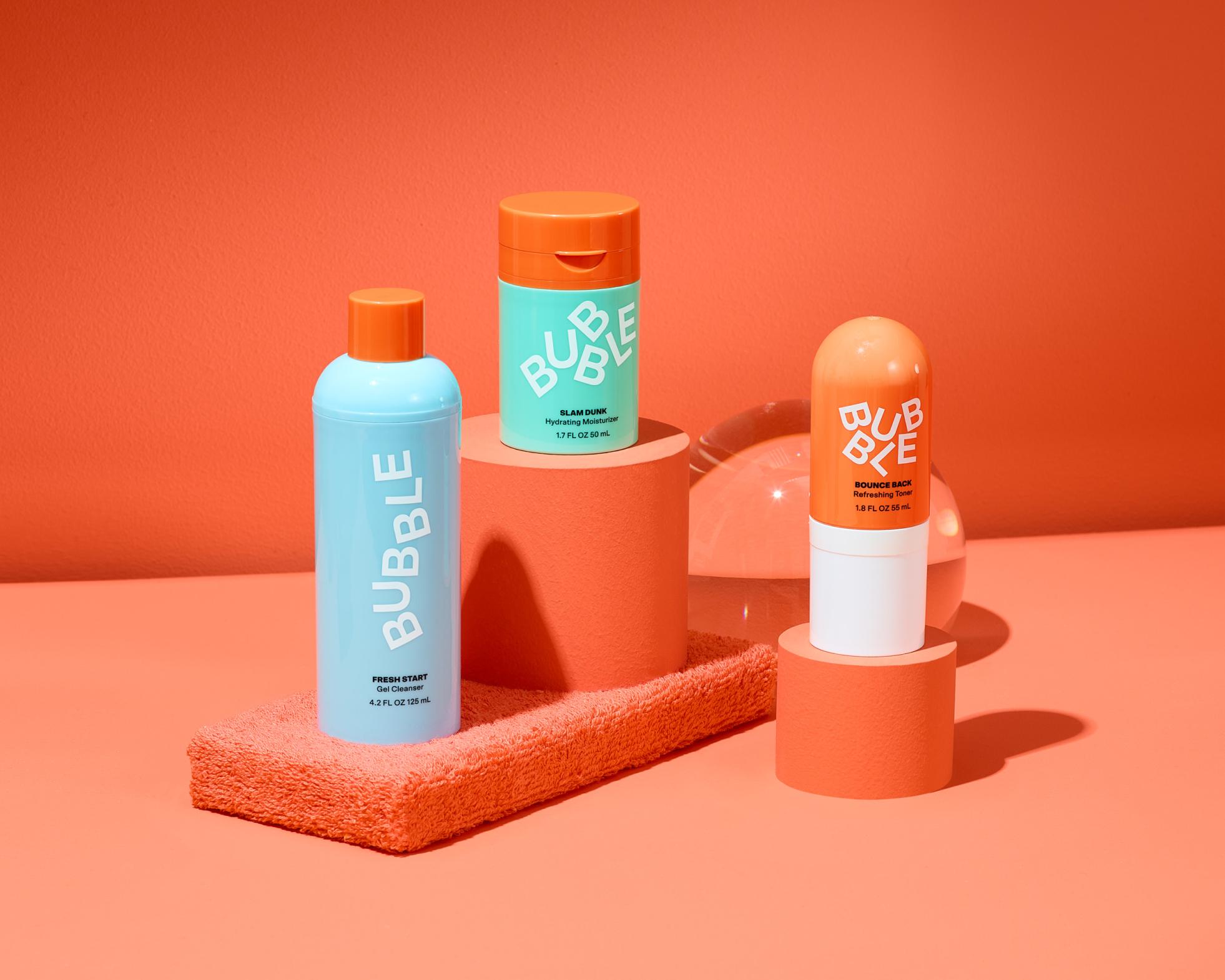 Bubble skincare products arranged on orange display stands