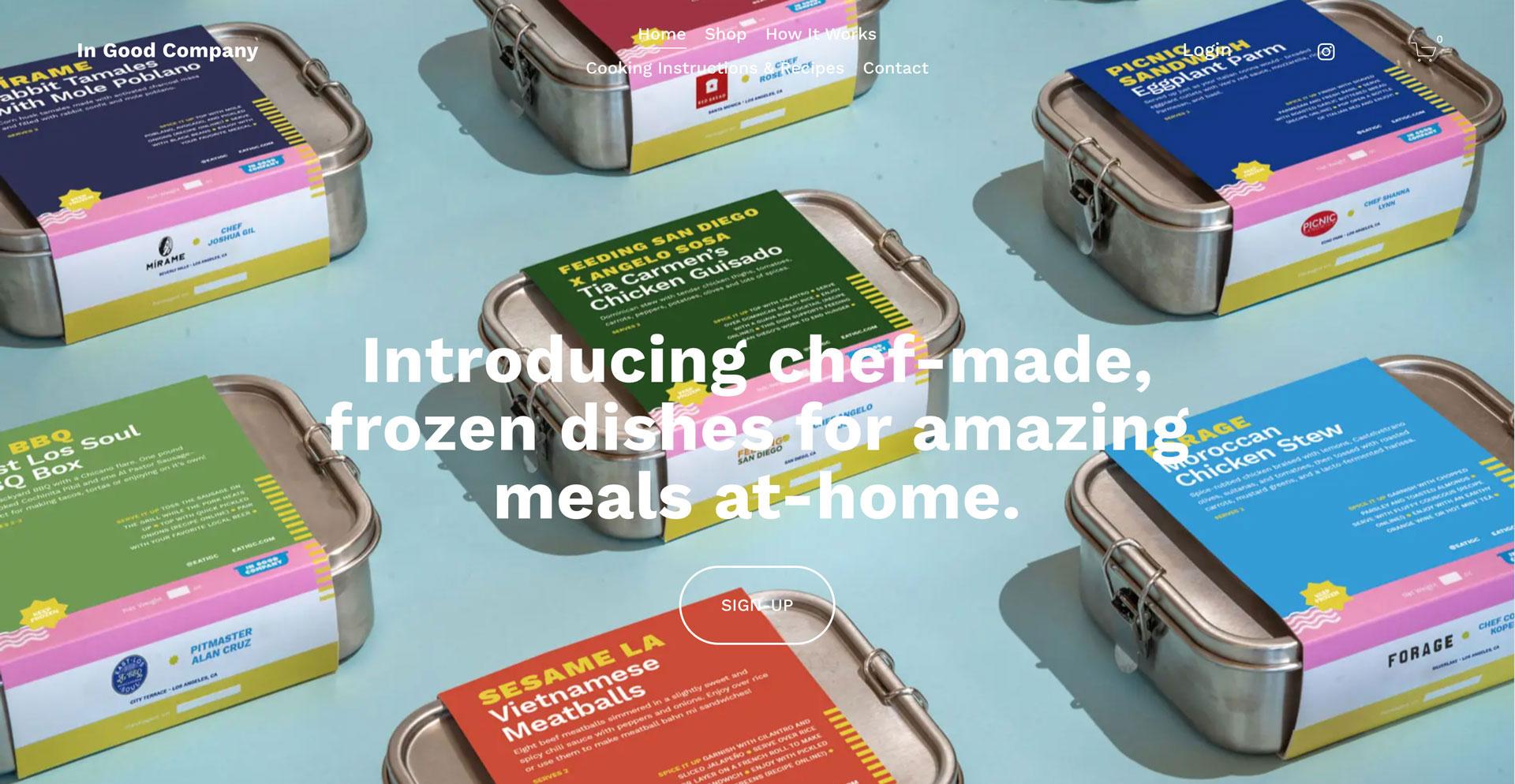 In Good Company homepage: steel meal tins with colorful recipe labels under the headline "Introducing chef-made, frozen dishes for amazing meals at-home."